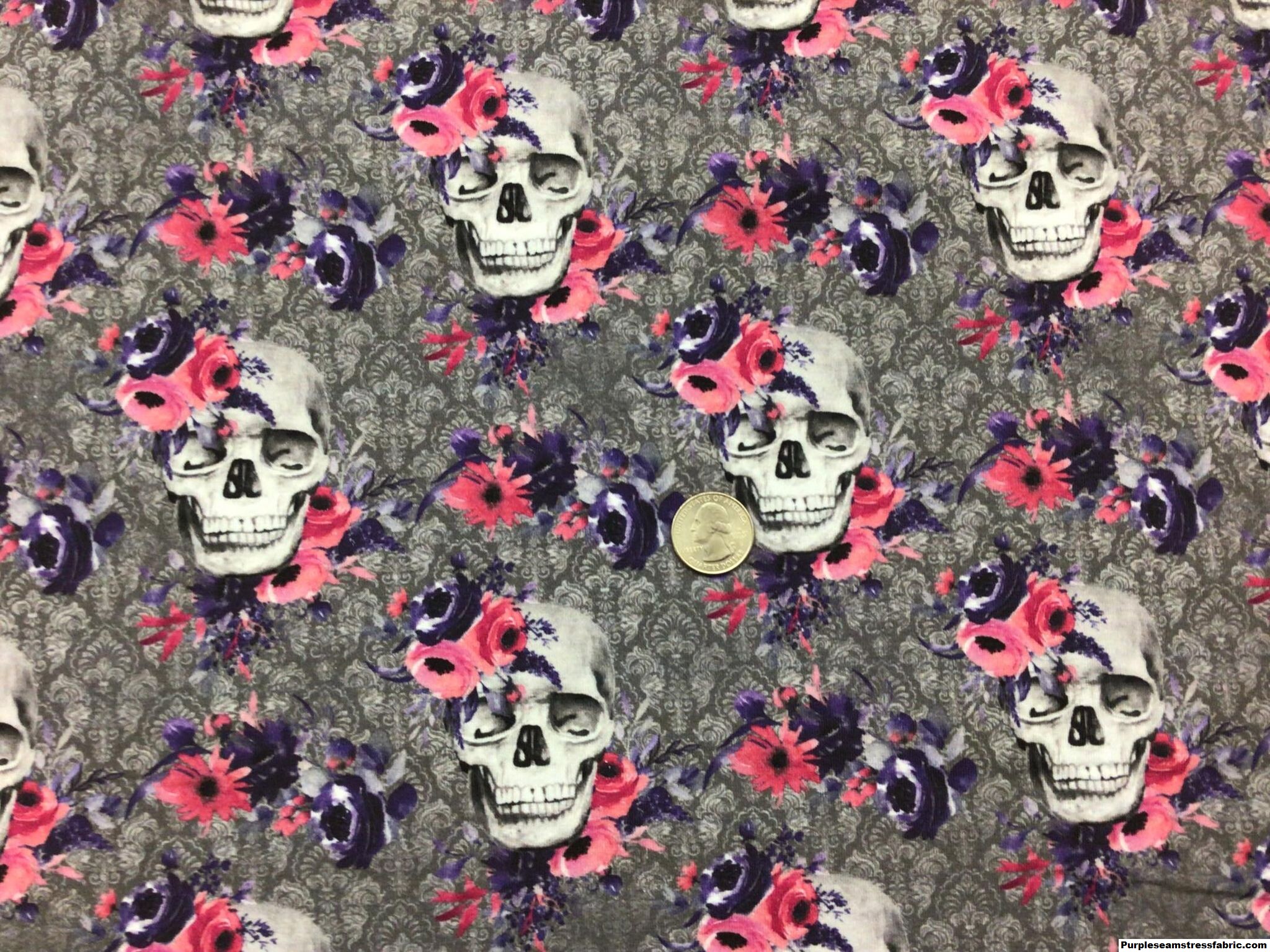 https://purpleseamstressfabric.com/wp-content/uploads/2023/02/Floral-Skulls-on-grey-Demask-2.jpg