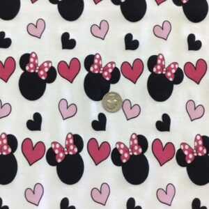 Minnie Mouse Heads wearing bows on White Cotton Lycra