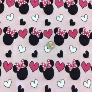 Mouse Heads wearing bows on pale Pink Cotton Lycra