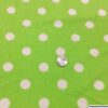 White polka dots on lime